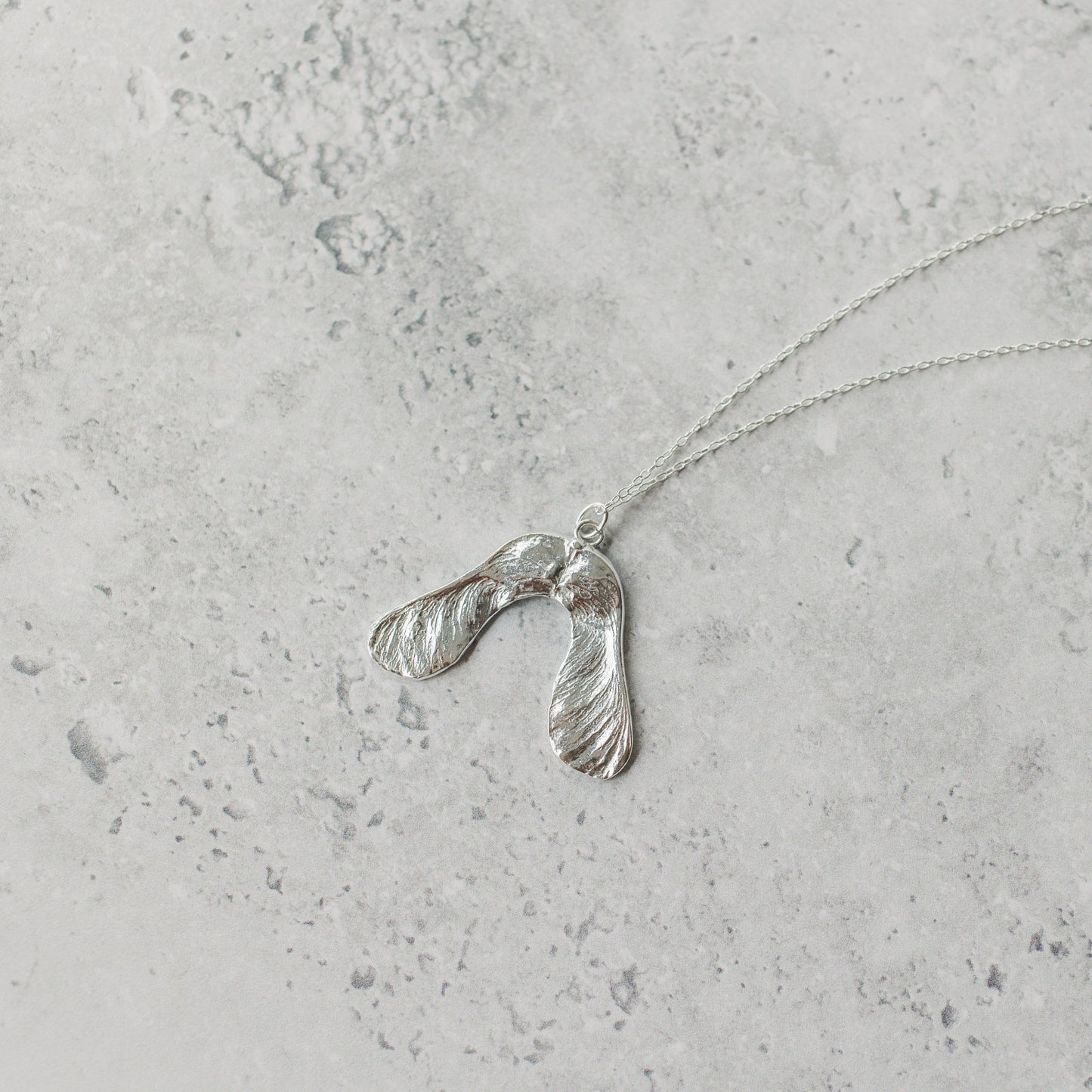 Handmade silver sycamore seed necklace