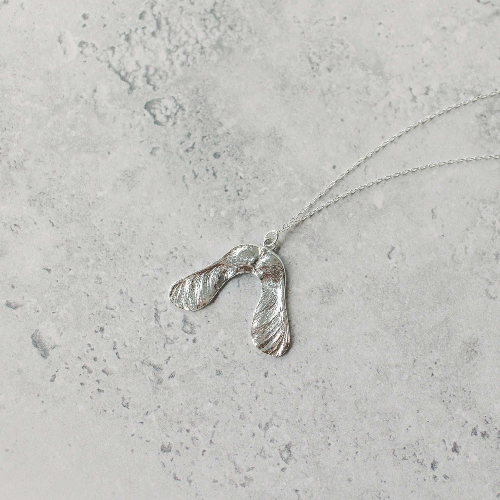 Handmade silver sycamore seed necklace