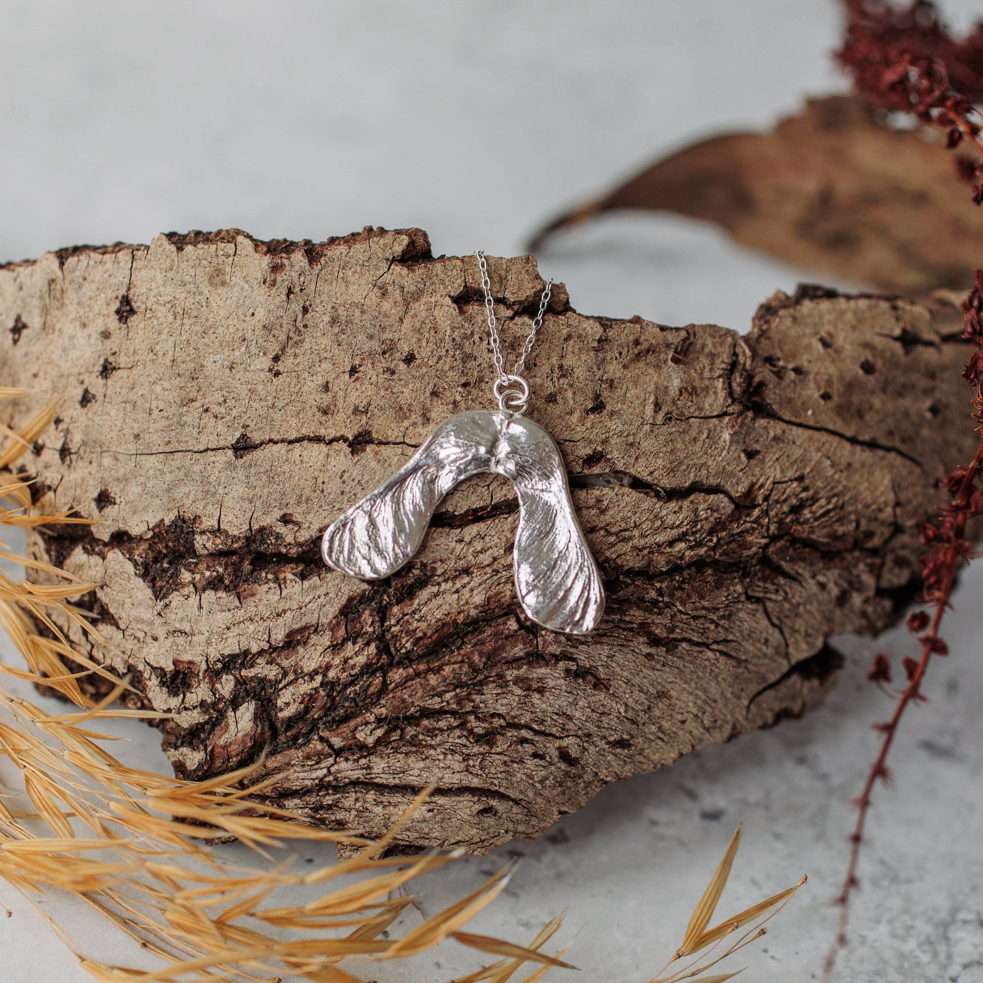 Handmade silver sycamore seed necklace