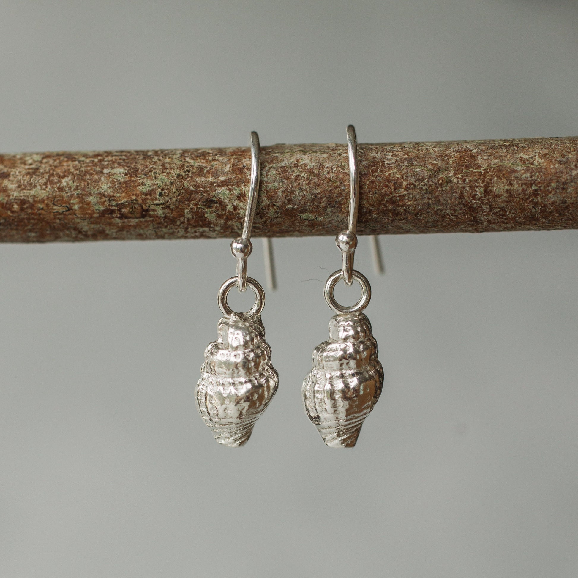 Handmade silver dainty whelk shell earrings