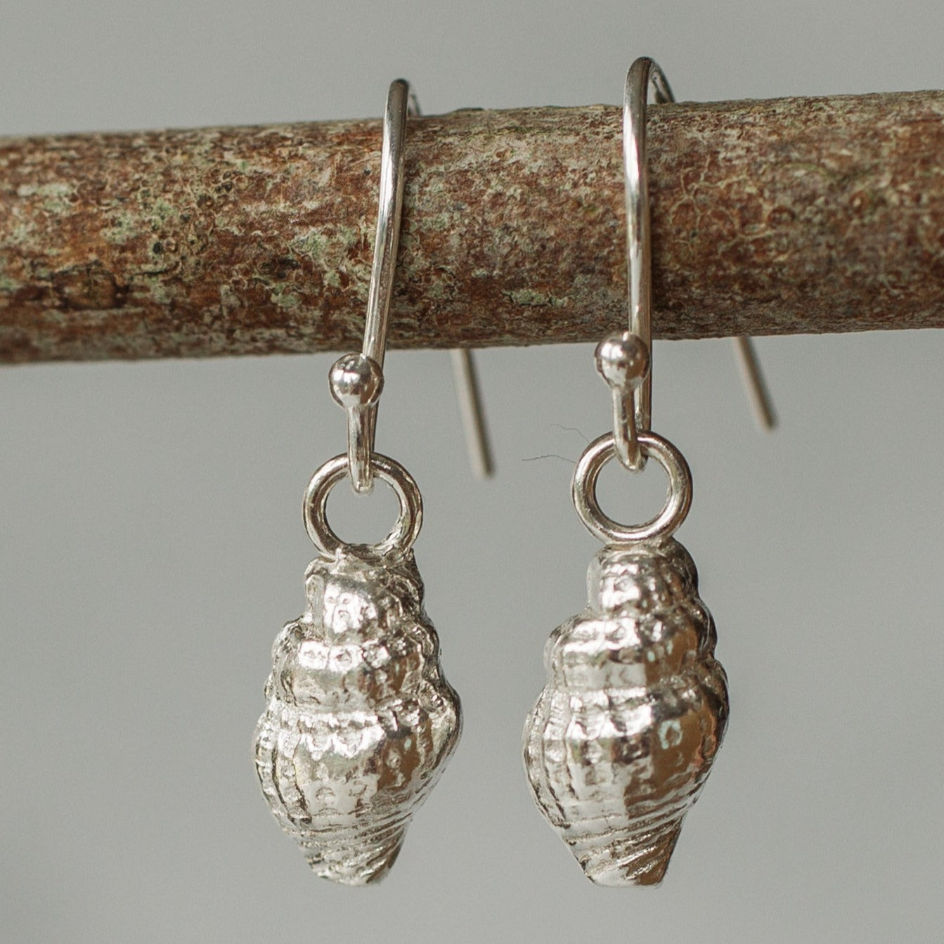 Handmade silver dainty whelk shell earrings