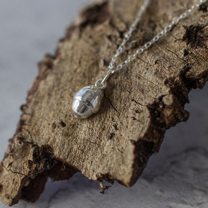 Handmade silver baby acorn necklace